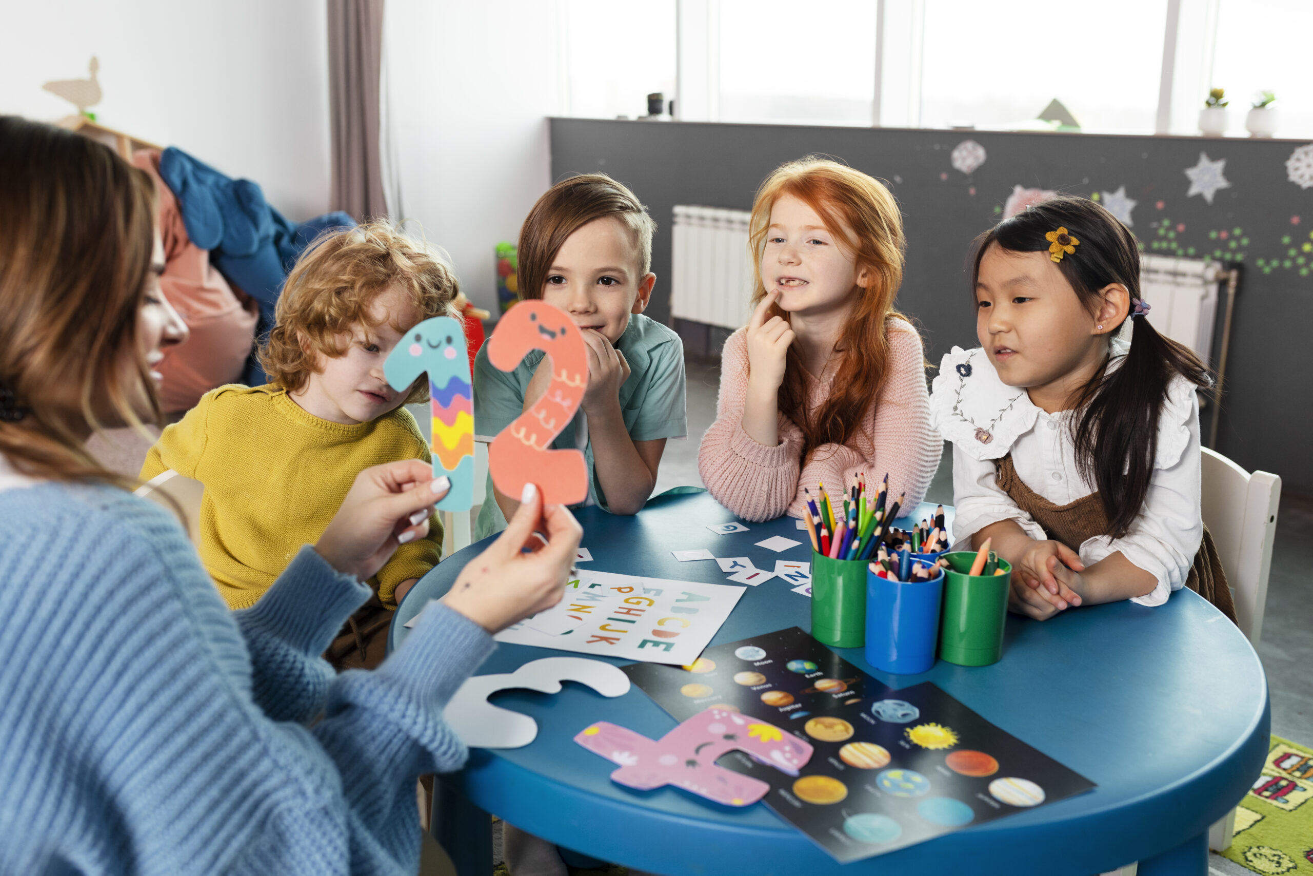 medium-shot-kids-sitting-together-table